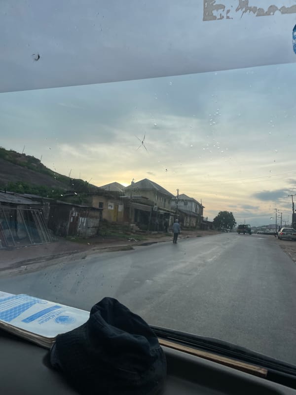Rain-dotted windshield view on Rukuba Road, Nigeria