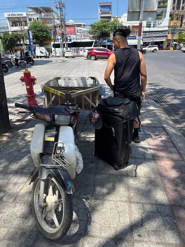 Morning street activity near Nha Trang's roadside transit corridor
