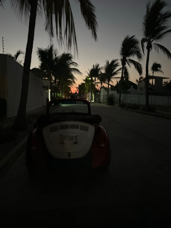 Classic VW Beetle spotted on Puerto Escondido street at twilight