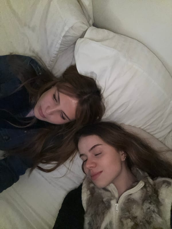 Two women rest in Parisian apartment near café de la poste