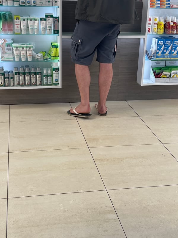 Person visits pharmacy in Saarbrücken wearing casual summer attire