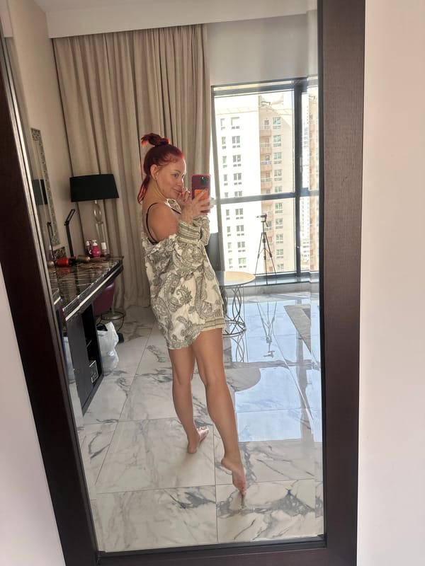 Hotel mirror selfies in a Dubai room, June 2026