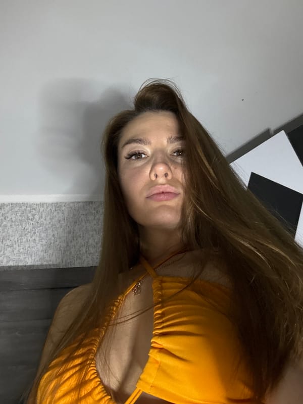 Indoor close-up series, orange top, relaxed poses