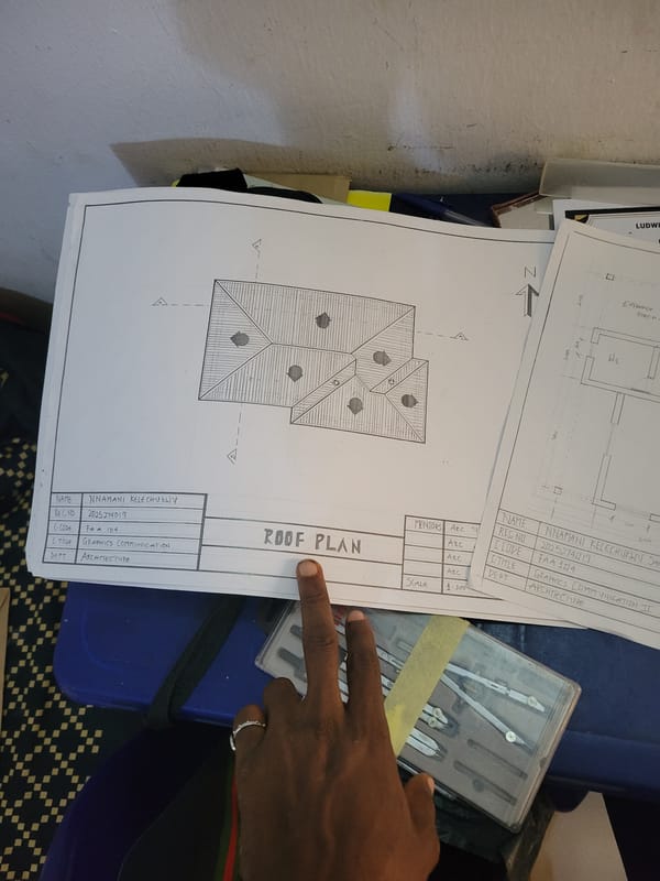 Reviewing architectural roof plans in Egbagu, Nigeria