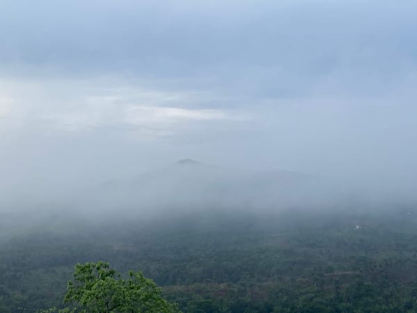 Morning fog blankets mountains in Achara, Nigeria