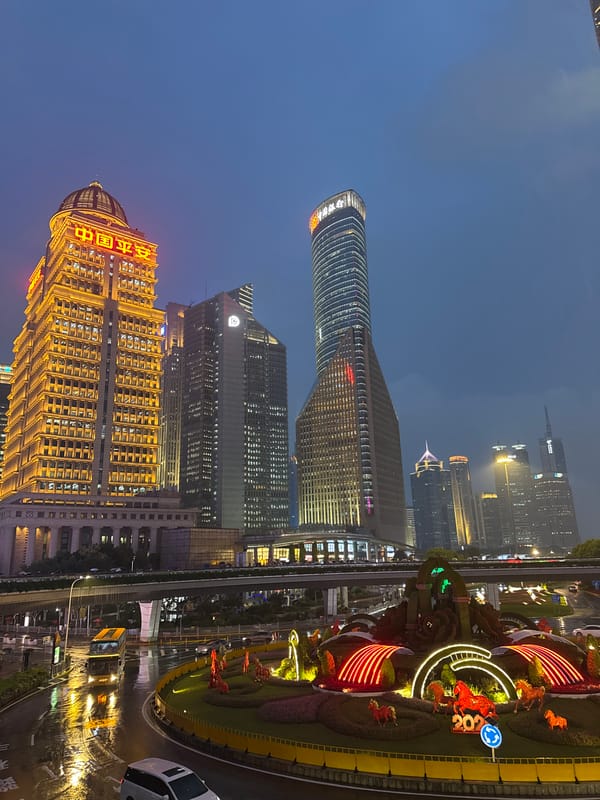 Pudong skyline at dusk and night, Oriental Pearl Tower glowing