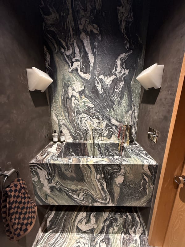 Interior home photos capture bathroom and books in LA