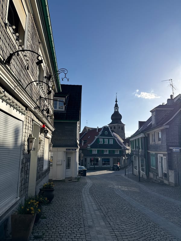 Street photography captures Remscheid church district on sunny afternoon