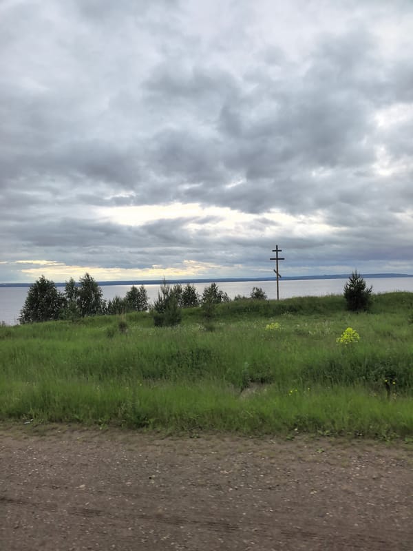Rural dirt road documented under overcast skies