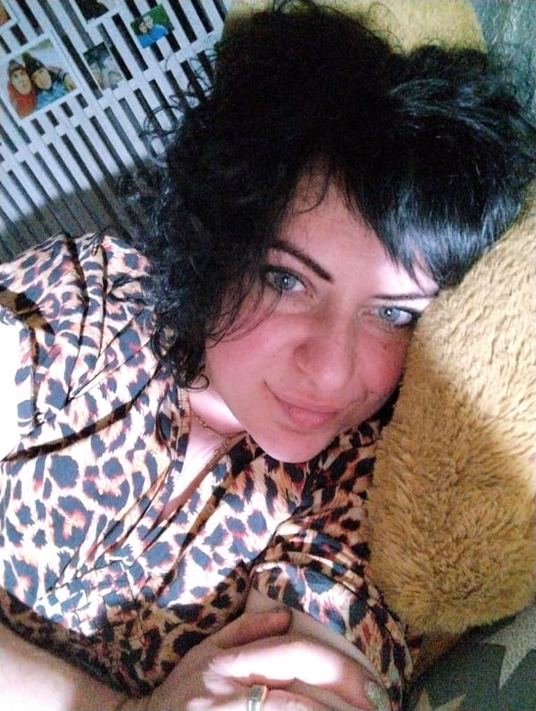 Woman photographed with teddy bear in Grishanki home