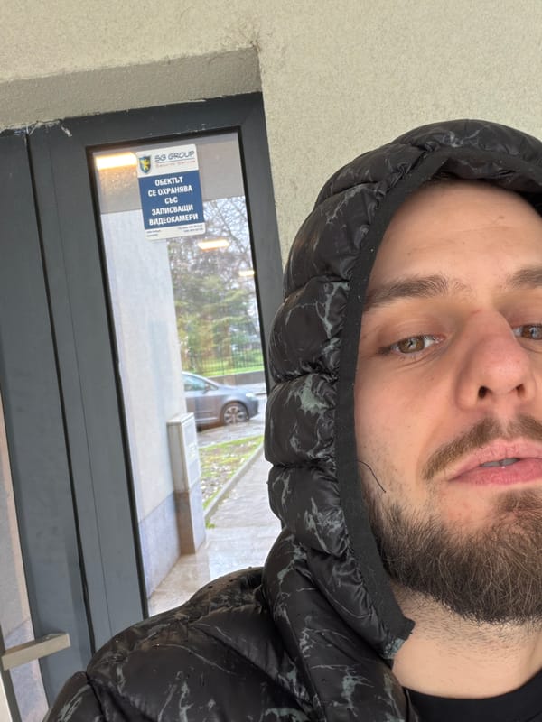 Man takes selfie near business window in Plovdiv