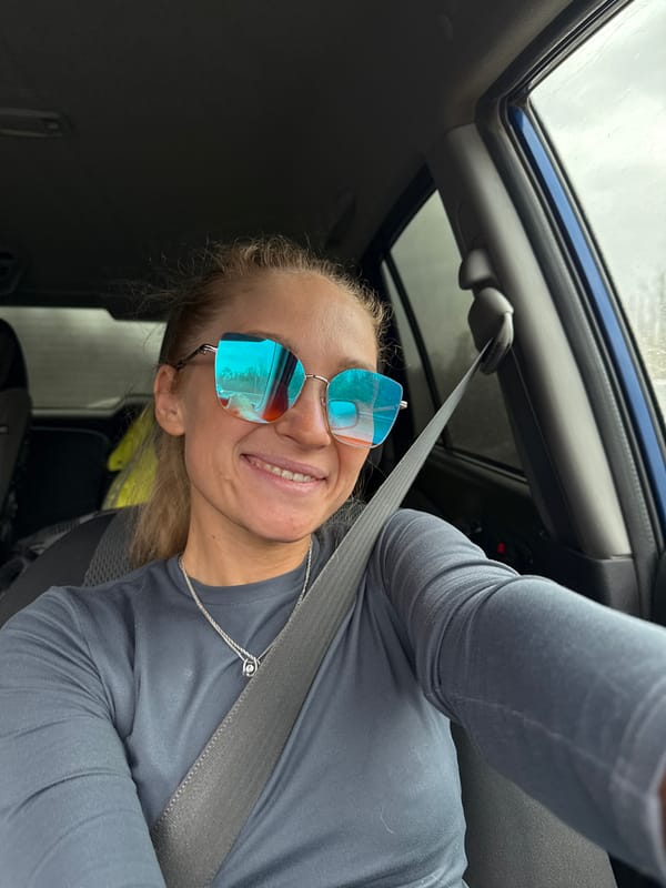 Person photographed smiling in vehicle in Krasnokamsk, Russia