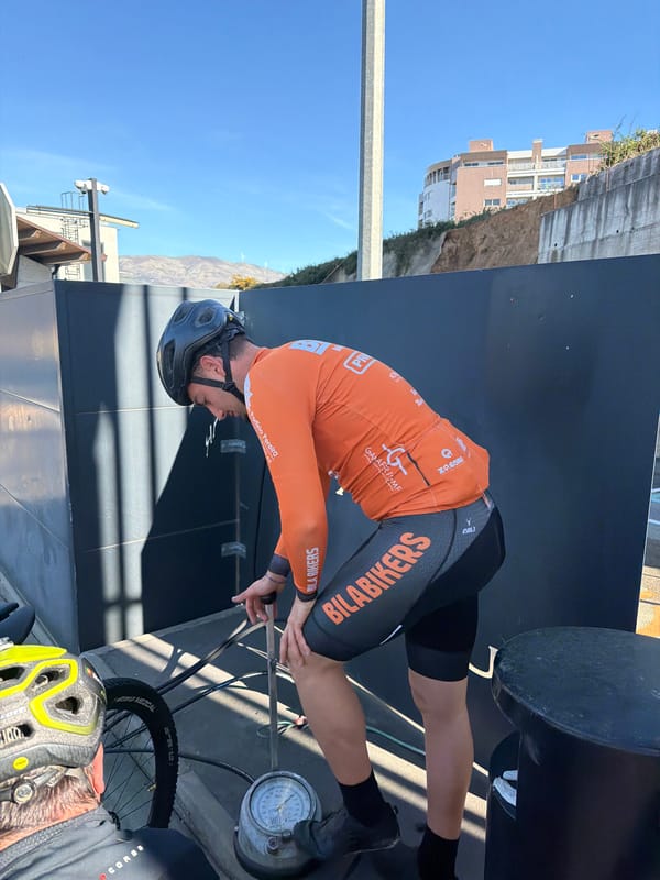 Cyclists examine structure at Vila Real toll booth