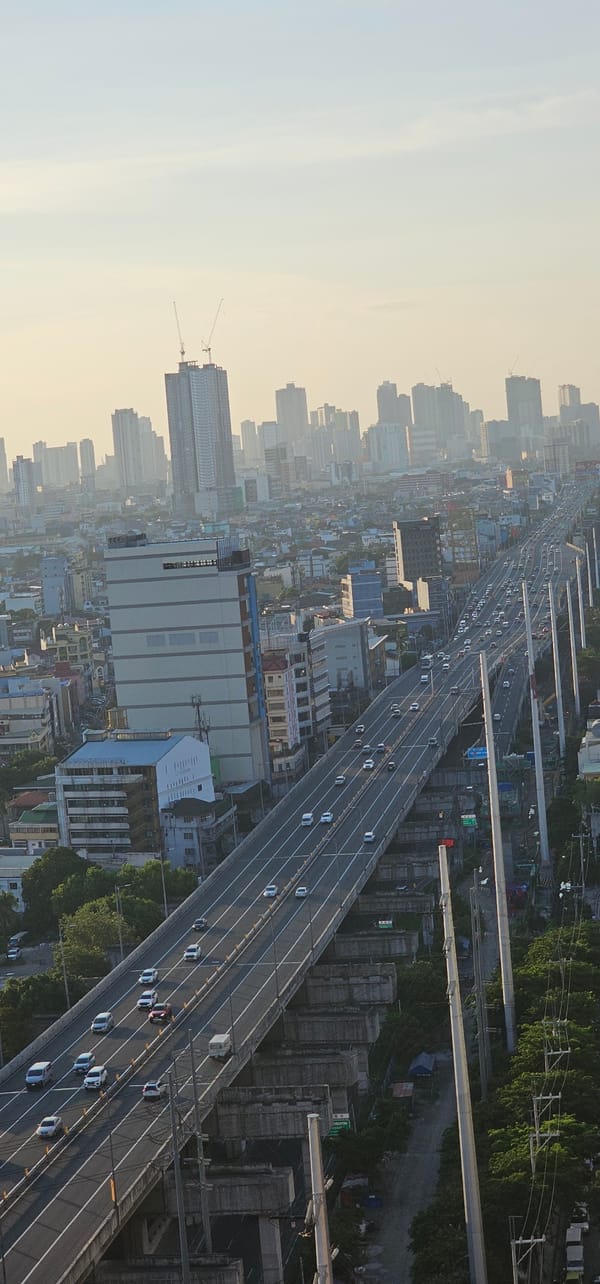 Makati's Skyway and skyline under a hazy morning glow