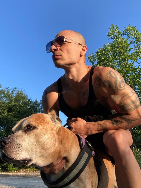 Tattooed man photographed with dog in early morning Pleven