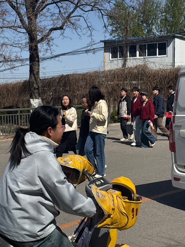 Young people walk outdoors in sunny Zhongtun, China