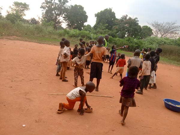 Children gather for outdoor games in Ngalula, DRC