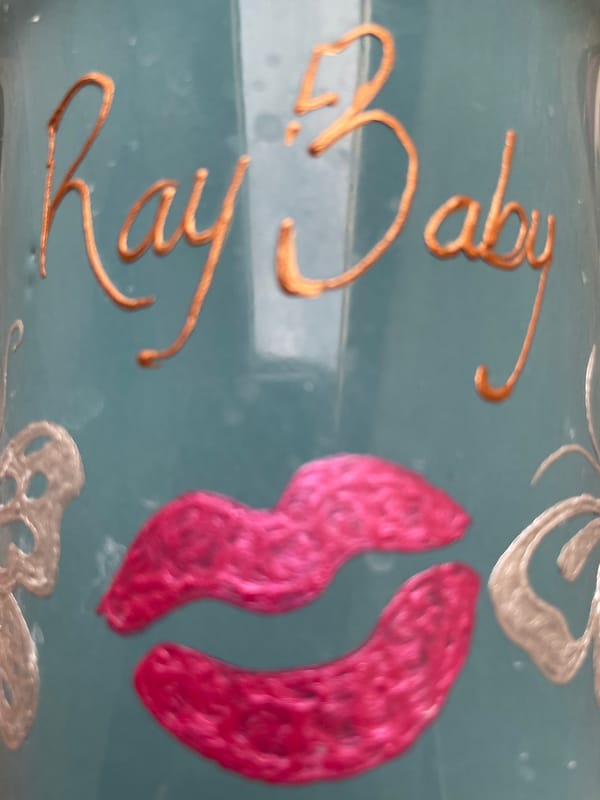 Decorative blue surface with gold "Ruby Baby" text observed in Nigeria