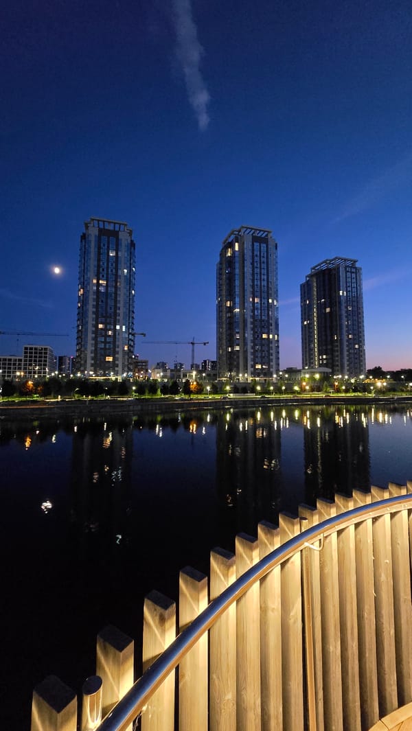 Summer evening along Kyiv's Obolon waterfront at sunset