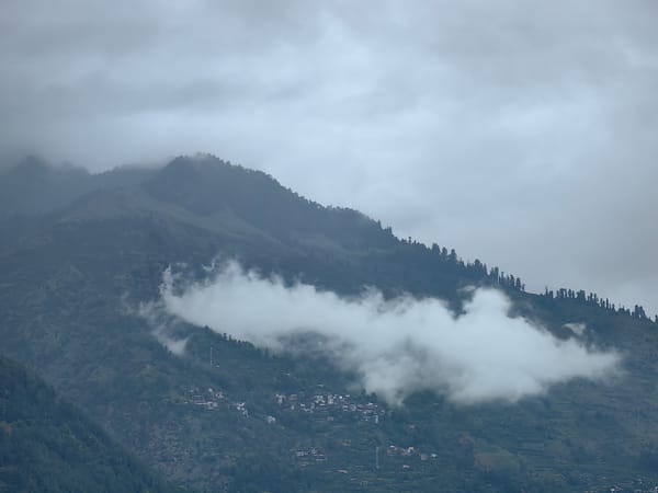 Early morning clouds shroud Vashisht mountain village