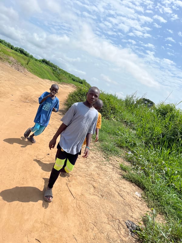 Daily life unfolds on dirt roads in Idah, Nigeria