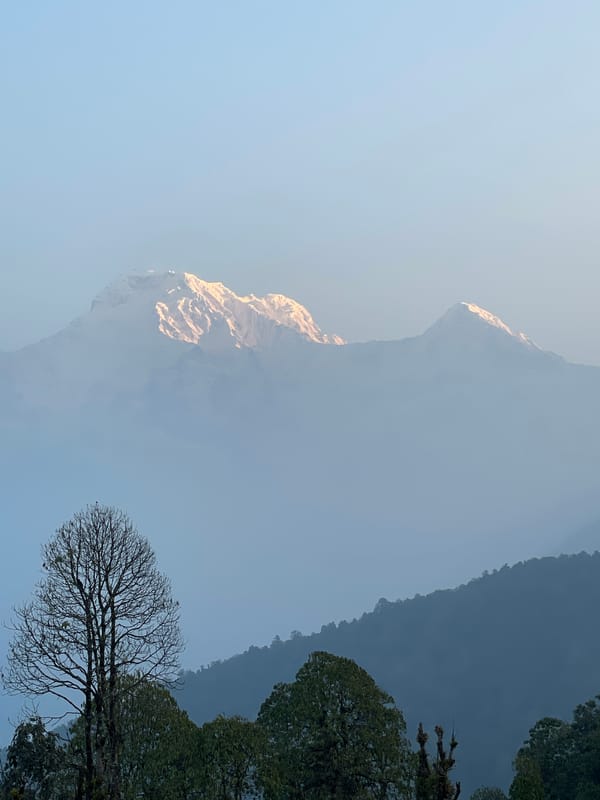 Mountain landscape documented in hazy conditions at Dhampus, Nepal