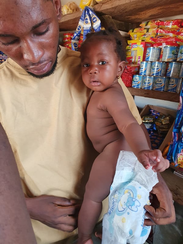 Family life unfolds in small shop in Lokoja, Nigeria