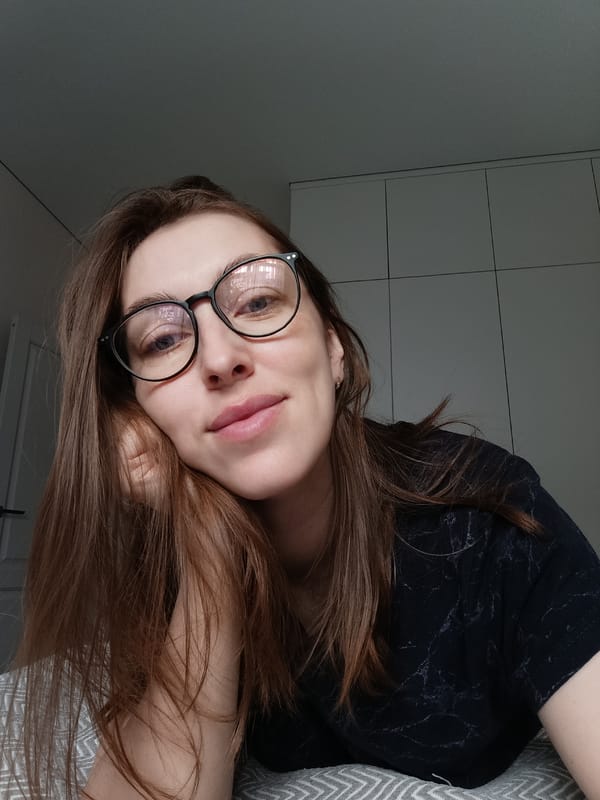 Woman takes morning selfies with cat in Russian home