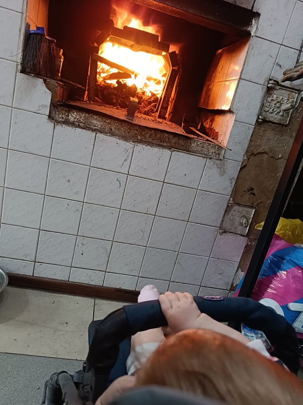 Child observed near active fire in tiled oven