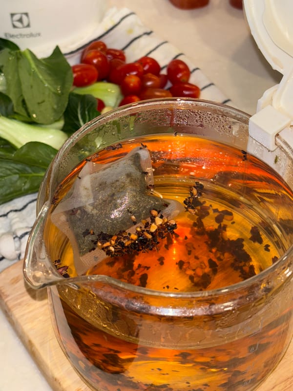 Person enjoys Sprite drink outdoors in Choeng Thale, Thailand