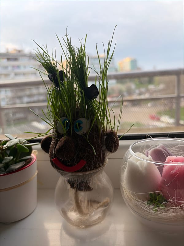 Woman rests on sofa with towel-wrapped head in Burgas