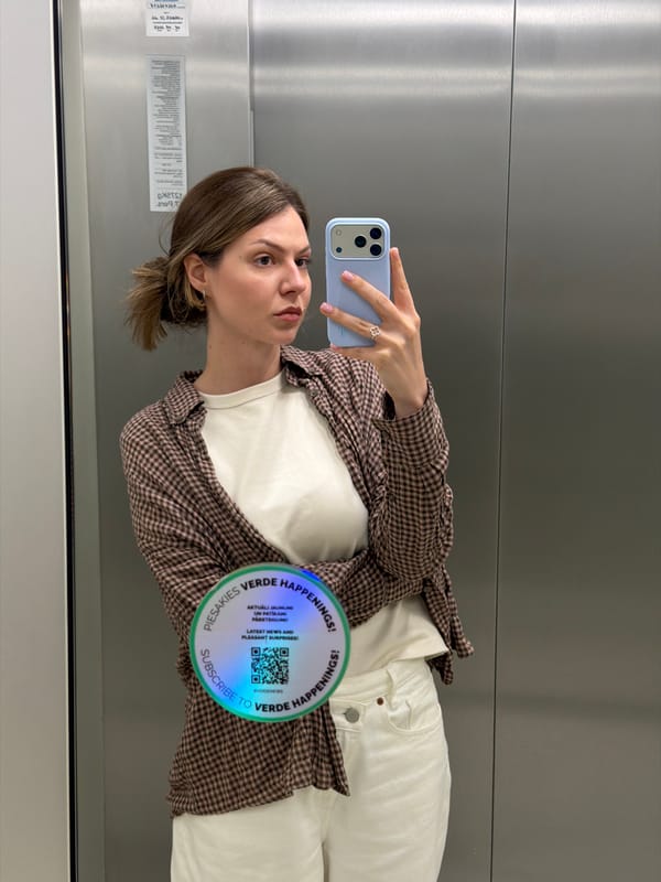 Inside a Riga building — elevator selfie and marble lobby floor