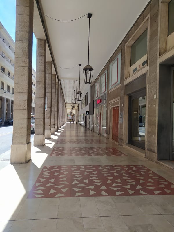 Porticoed walkway along Via Grande in central Livorno