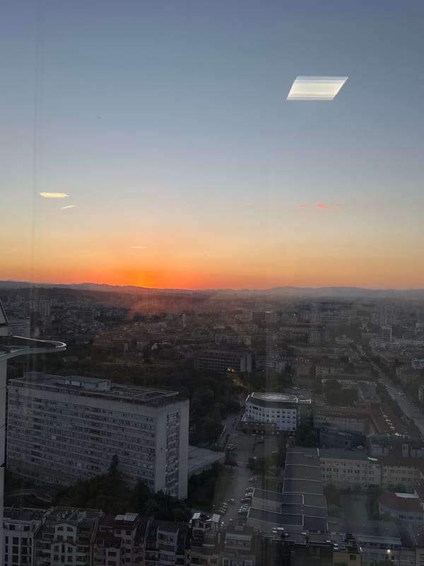 Sofia sunset viewed from high-rise buildings across city