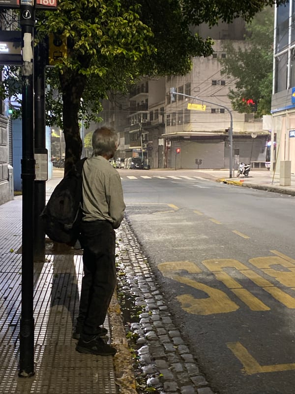 Man stands on Buenos Aires sidewalk during morning hours