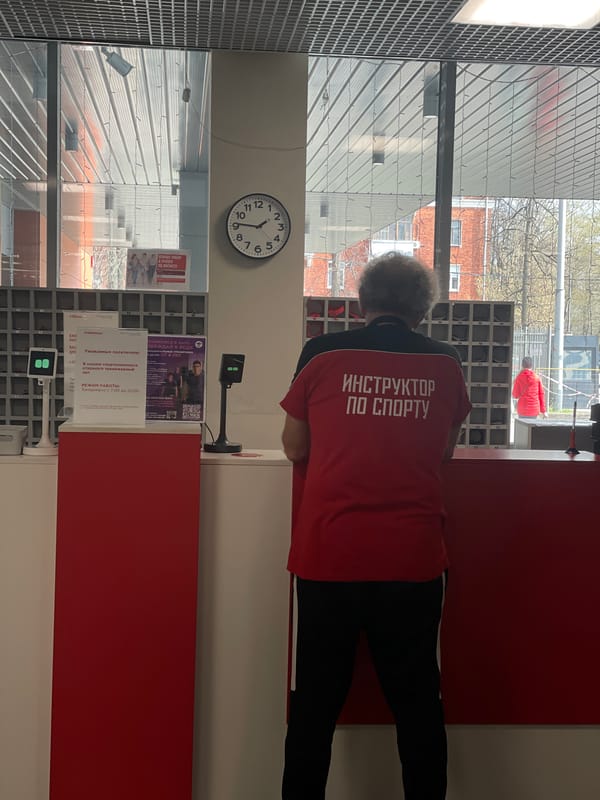 Sports instructor in red shirt observed near counter