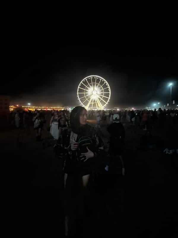 Coachella festival nighttime crowds gather around illuminated installations
