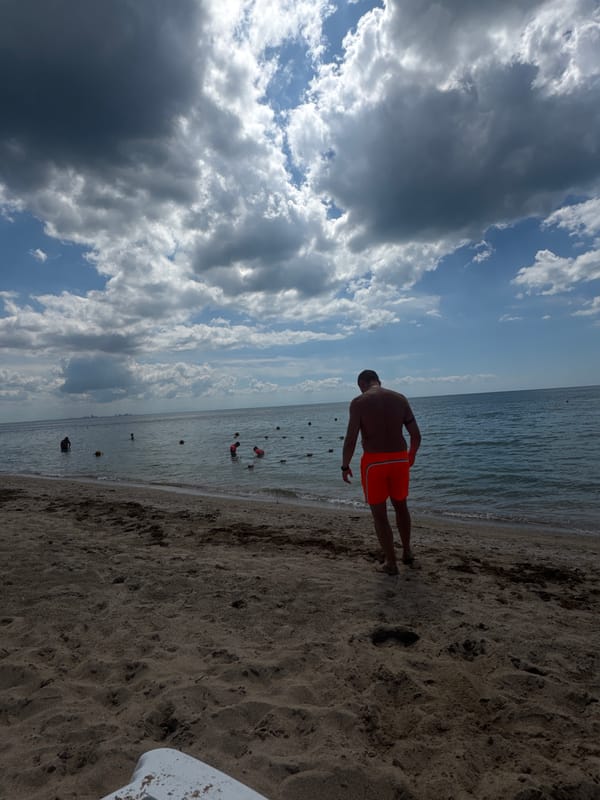 Family enjoys morning beach outing in Yevpatoriya, Ukraine