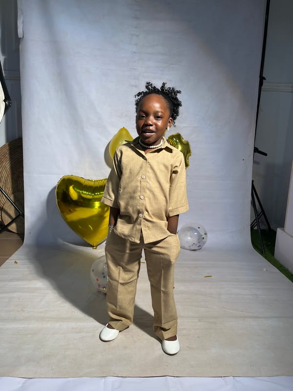 4th birthday studio shoot with gold balloons, Nigeria