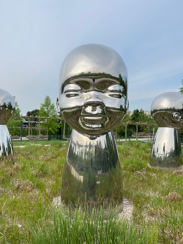 Metallic baby sculpture installation documented in Krasnodar park
