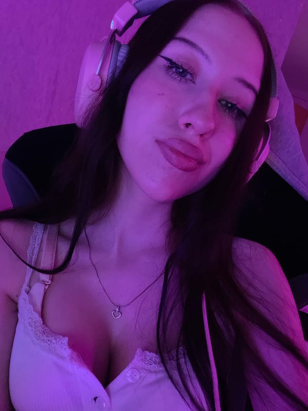 Woman photographed multiple times in purple-lit bedroom in Votkinsk