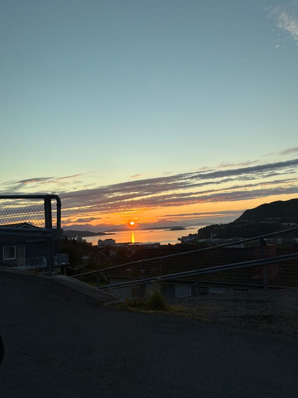 Late-night Arctic sunset glows over Harstad's waterfront