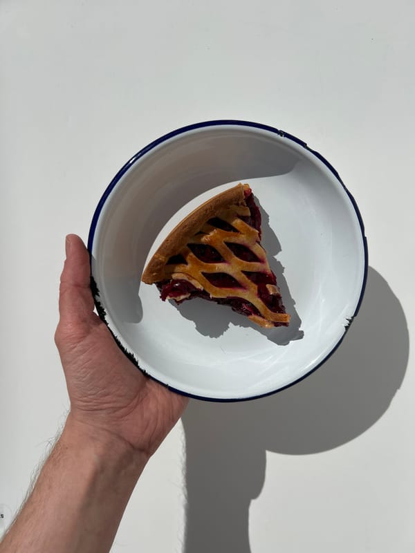 Cherry pie slice served on enamelware plate in Saint Petersburg