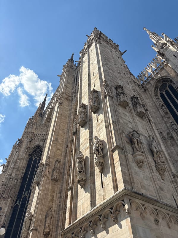 Tourist documents afternoon stroll through historic Milan landmarks