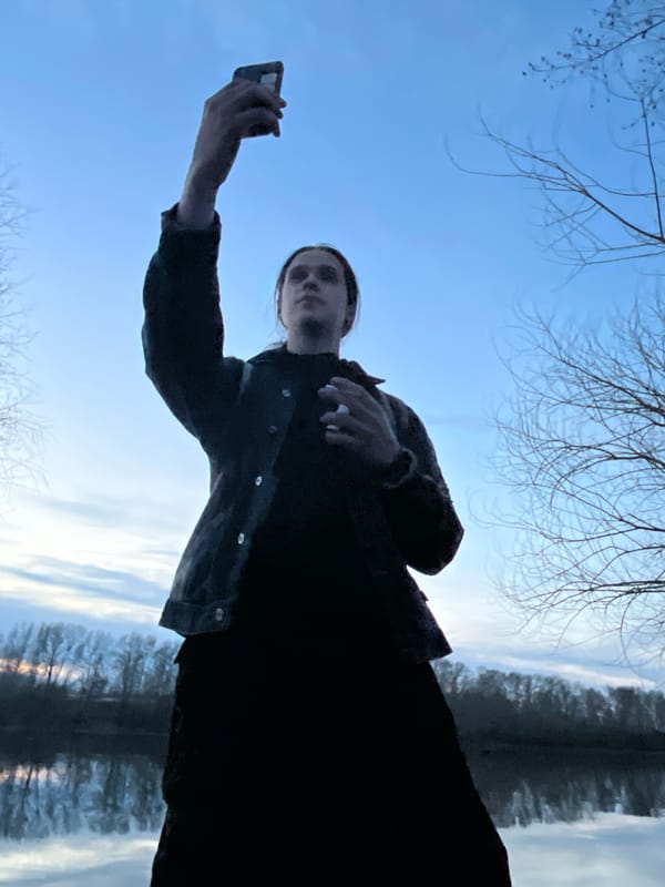 Person documents waterfront visit in Chaikovsky, Russia