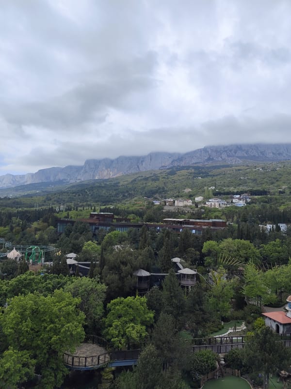 Coastal landscape with mountains and modern buildings observed in Ukraine