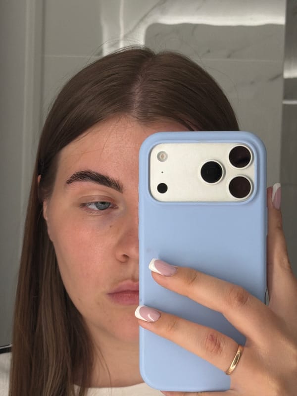 Woman takes bathroom selfies while getting ready in Russia