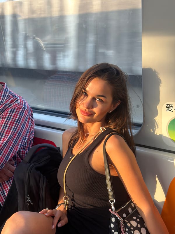 Woman rides train through Pudong district in morning commute