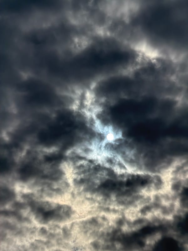 Dark clouds with sunbreaks observed over Riga, Latvia