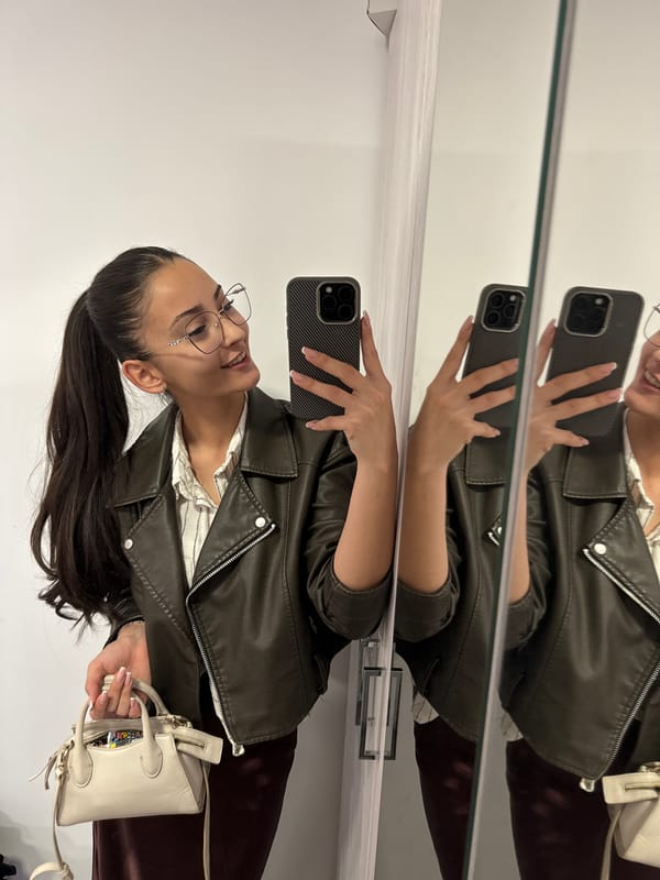 Woman takes mirror selfie in Dupnitsa, Bulgaria